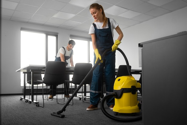 Free photo full shot people cleaning office