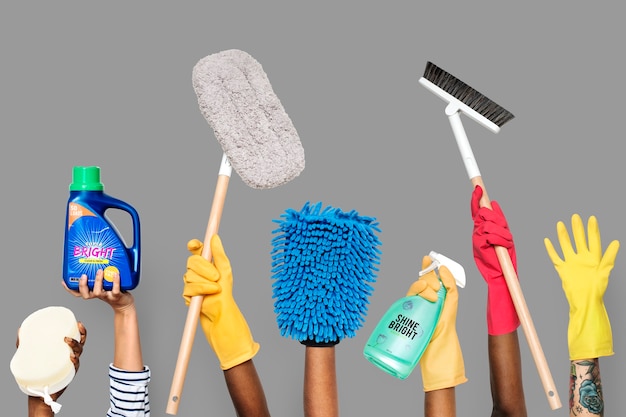 Free photo hands holding cleaning tools and solutions