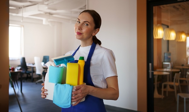 Free photo professional cleaning service person cleaning office