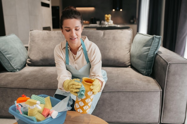Free photo young woman doing housework and looking busy