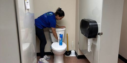 BraBos Cleaning team member cleaning commercial office restrooms