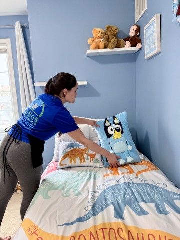 BraBos Cleaning staff member preparing a kid’s bedroom during an Airbnb cleaning in Boston
