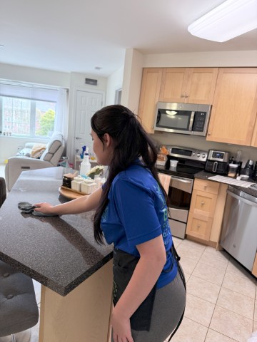 BraBos Cleaning staff member performing apartment cleaning in a Boston residence