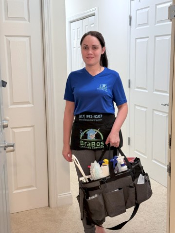 BraBos Cleaning staff member fully equipped with cleaning supplies while performing house cleaning in a Boston home
