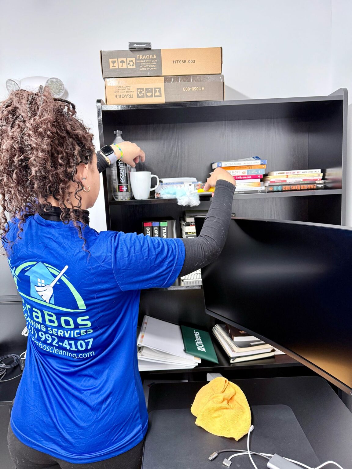 Brabos Cleaning staff member performing housekeeping duties in a Boston home
