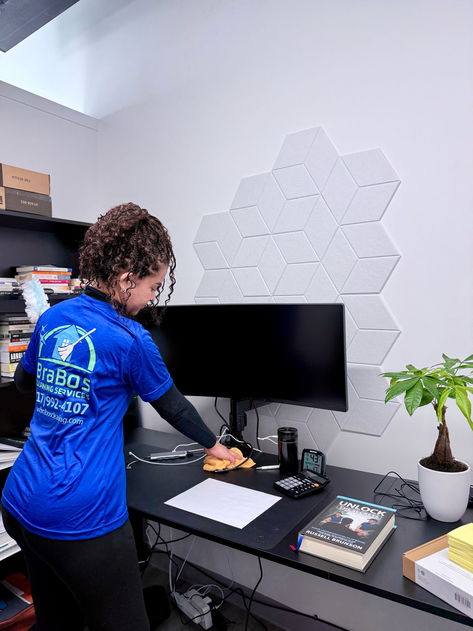 Brabos Cleaning team member performing commercial cleaning in a Boston office